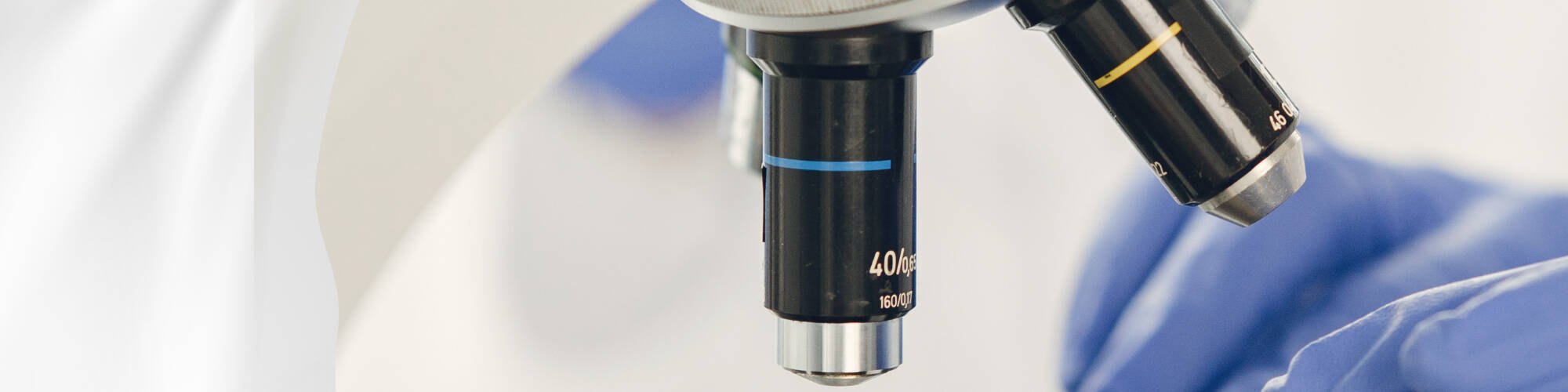 Microscope lenses and gloved fingers